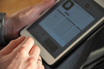 tablet in hand. crypto currency. Bitcoin