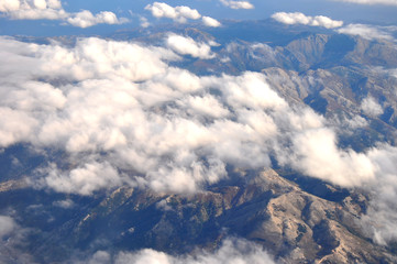 clouds and land from the type of aircraft