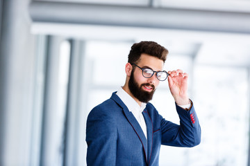 Young Handsome Businessman Posing At Workplace