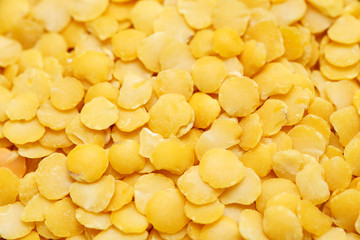 Yellow lentils macro shot, abstract texture or pattern