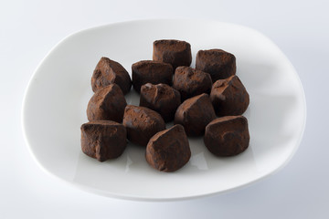 chocolate truffles on a white plate