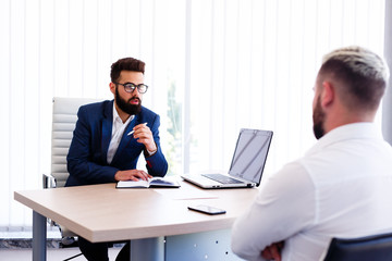 Young Businessman At Consulting With Lawyer