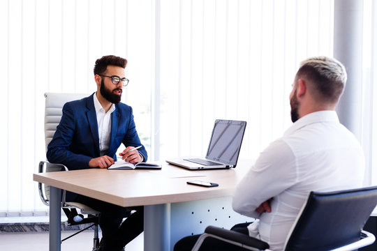 Young Manager Interviewing New Guy For Job