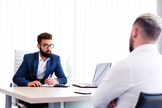 Young Manager Interviewing New Guy For Job
