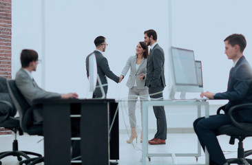 Salesmen and buyer discuss the contract