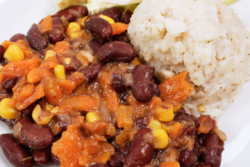 Red beans with corn and carrot, sorghum on a white