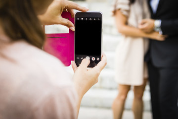 Hands using a smart phone