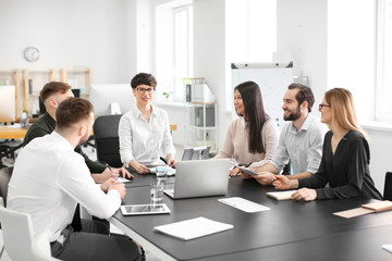 Office employees having meeting in conference room. Finance trading