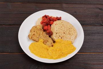 Sauce with seitan and dumplings on a table