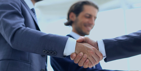 Cropped image of business people shaking hands