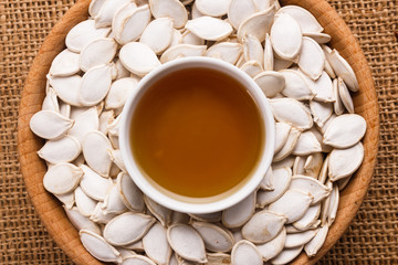 pumpkin seed oil on a rustic background