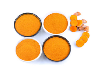 Turmeric roots and turmeric powder isolated on white background