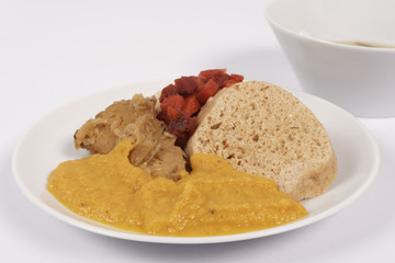 Sauce with seitan and dumplings on a on a white