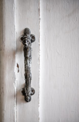 Vintage handle on white door