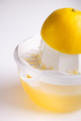 Lemon and juice on a white background