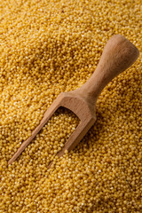 bowl of millet on a white wooden background