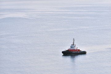 Tug boat stands without traffic in the sea. Tug boat alone in the sea
