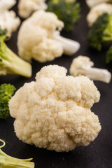 cauliflower and broccoli on a rustic background