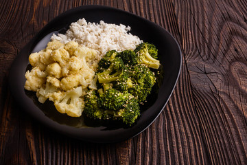 cauliflower and broccoli on a rustic background