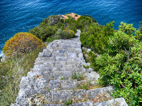 View of the old stone stairway leading to Monesteroli, a small village of fishermen in La Spezia Province, near Cinque Terre, Italy