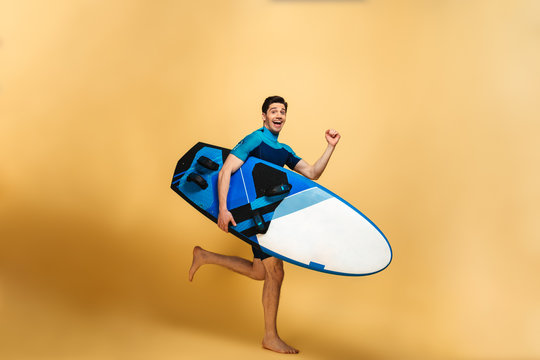 Full length portrait of a smiling young man