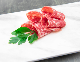 marble dish with salami slices