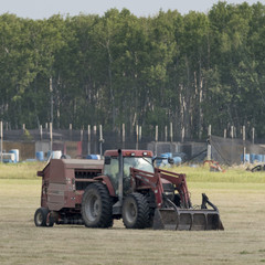 Tractor in a field, Manitoba, Canada
