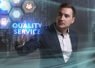 Business, Technology, Internet and network concept. Young businessman working on a virtual screen of the future and sees the inscription: Quality service