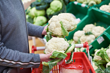 Woman buys cauliflower