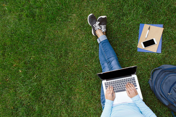 Student studying outdoors.