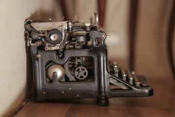 Fototapeta na wymiar Vintage typewriter on the floor in a French cottage