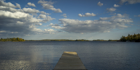 Wooden Dock in a lake, Kenora, Lake of The Woods, Ontario, Canada