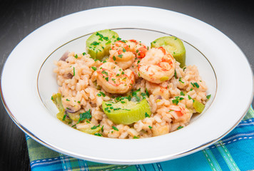 dish with risotto with prawns and zucchini