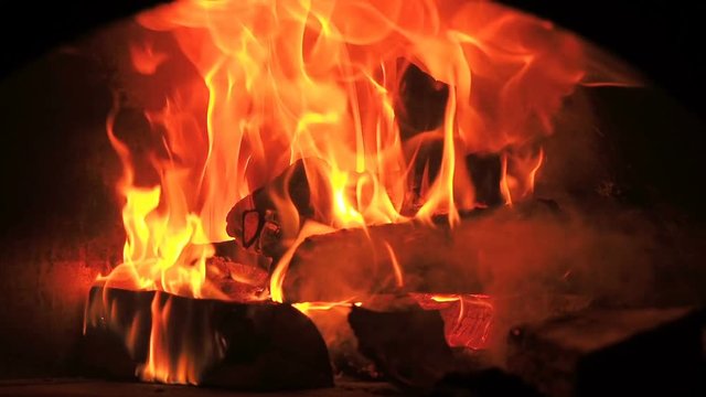 Beautiful Fire Close Up Slow Motion. Video Clip of Burning Firewood in the Fireplace. Firewood Burn in the wood burning stove. 30fps Full HD