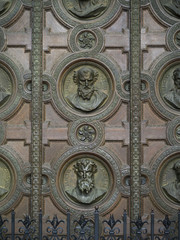 Carvings of faces on the door of St. Stephen's Basilica, Budapest, Hungary