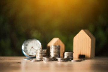 Saving to buy a house or home savings concept with money coin stack growing.Saving money concept.