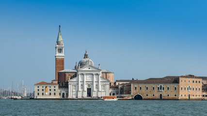 Saint George Church and its bell tower overlooking the historic centre of Venice, Italy on the Giudecca Canal.