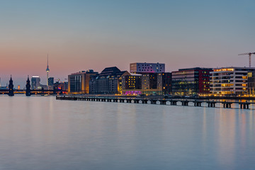 The Spree river in Berlin after sunset with the famous Television Tower in the back