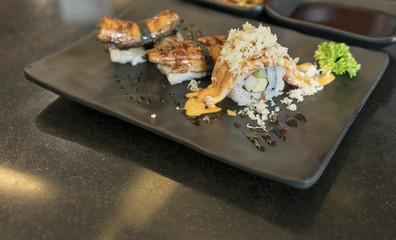 Salmon Sushi or Salmon harasu (belly) with sauce served in Japanese restaurant