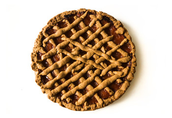 Delicious round cake on the kitchen white table. Healthy eating. Horizontal shot. Close-up