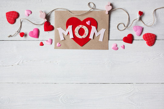 Background for congratulations for Mother's Day with card and hearts