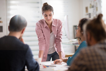 meeting office. A young woman presents her project