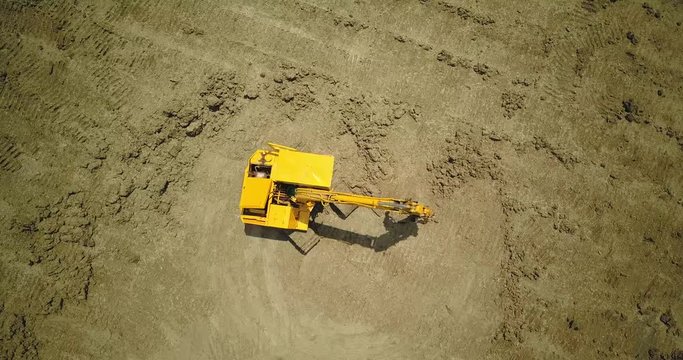  drone with camera flying to digger machine 2