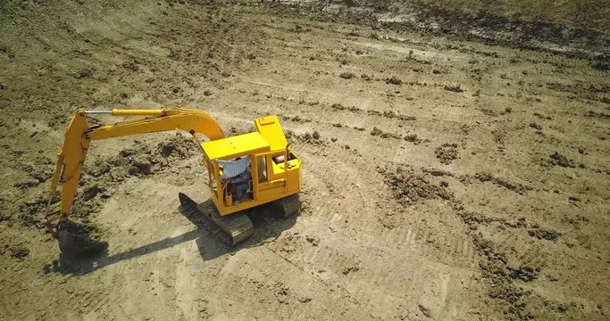  drone with camera flying to digger machine 1