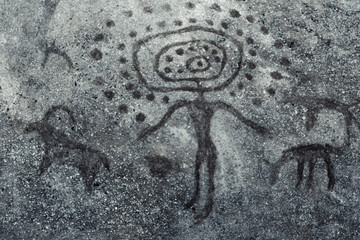 image of an ancient man on a cave wall. history of antiquities. archeology