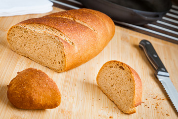 Sliced freshly baked homemade bread close-up. Tasty and healthy wheat bread with bran