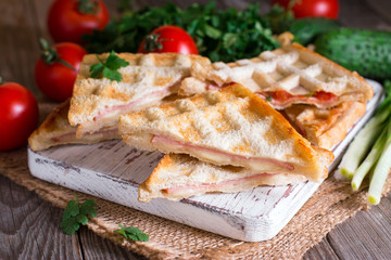 Pressed and toasted double panini with ham and cheese