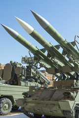 A rocket launcher with three missiles on a caterpillar installat