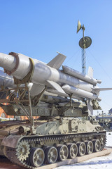 A missile system with three missiles on a caterpillar track