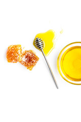 Apiary products. Honey in bowl and honeycomb on white background top view copy space close up